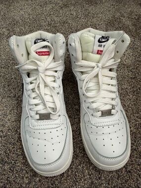 Nike White High-Top Leather Sneakers with Red Supreme Tag